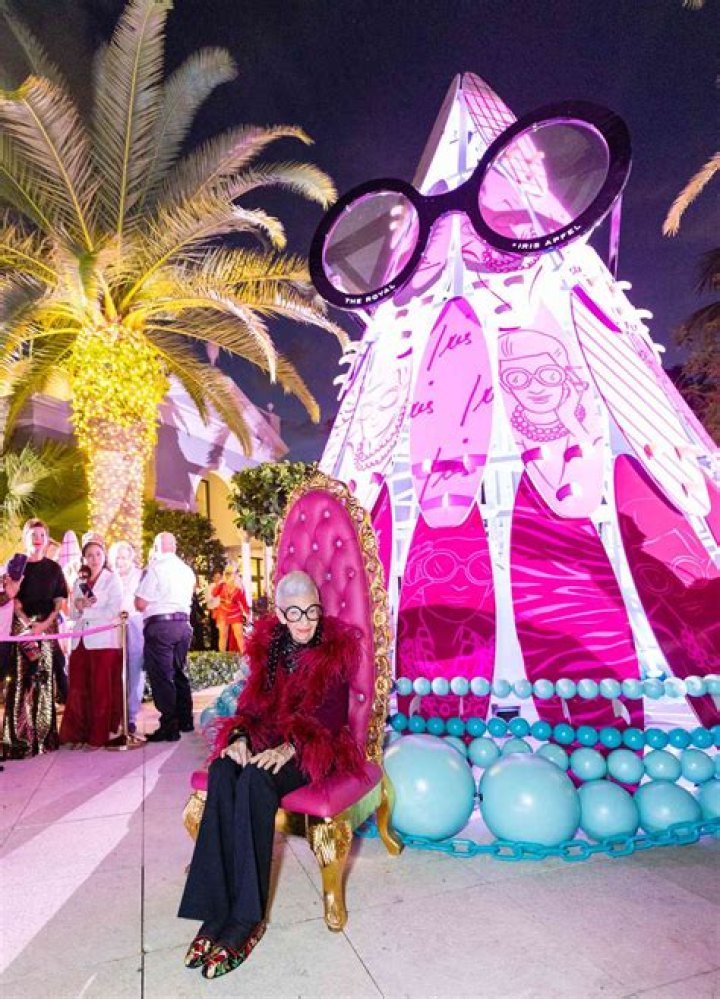 
101-Year-Old Fashion Legend Iris Apfel Lights Up a Giant Holiday Tree That Wears Her Iconic Glasses 